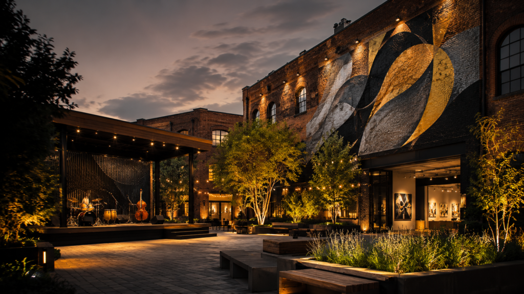 Outdoor arts venue with mural, gallery and performance stage
